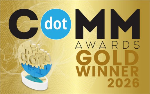 A gold and blue dotCOMM Awards trophy, celebrating Marketing Awards & Accolades, with text: "dotCOMM Awards Gold Winner 2026" on a gold background.